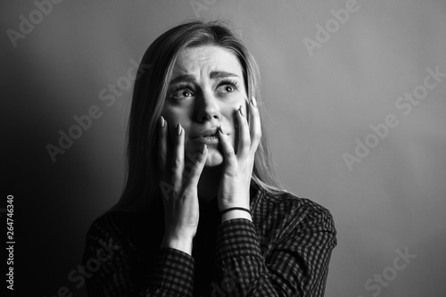 Portrait of scared young woman. Black and white