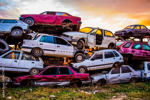 Pile of discarded old cars on junkyard