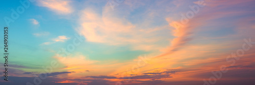 Panoramic beautiful colorful golden hour twilight sky. Beautiful cloud and sky nature background in magic hour. Amazing colorful sky and dramatic sunset evening sky.