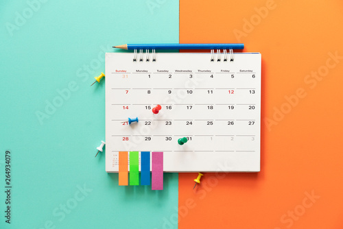 close up of calendar on the table with color background, planning for business meeting or travel planning concept