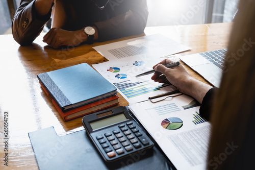 Close up Business woman and partner discuss about budget plan, tax, accounting, statistics and analytic research concept.