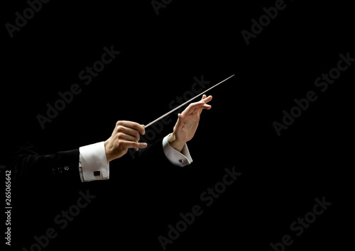 Hands of conductor on a black background