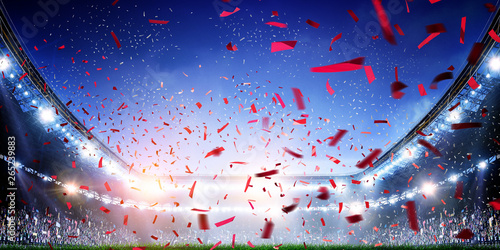 Football stadium background with flying confetti