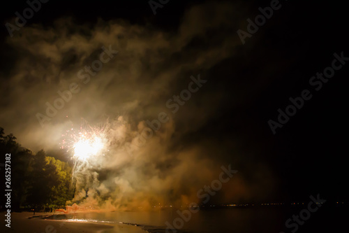 firework on black background for celebration party on the beach. at phuket thailand merry christmas and happy new year.