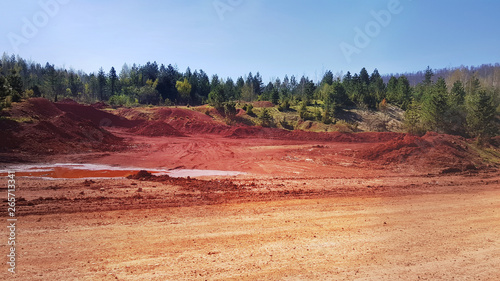 red ground landscape bauxite mineral aluminium ore near mine in Milici Bosnia and Herzegovina 