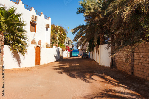 Street and coast of Red Sea in Dahab, Sinai, Egypt, Asia in summer hot. Famous tourist destination near of Sharm el Sheikh. Bright sunny light