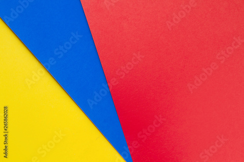Yellow,blue and red papers background.Concept of primary colors
