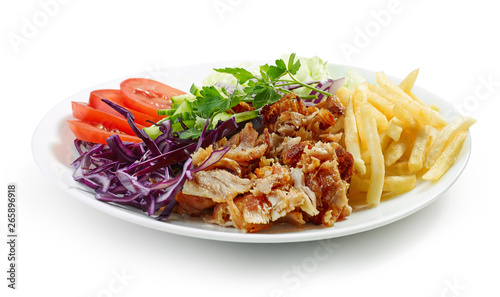 plate of chicken kebab and vegetables