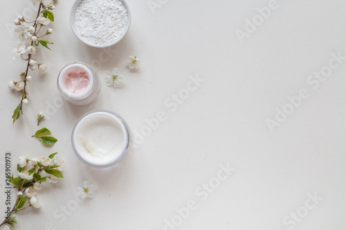 White background with organic cosmetics with natural ingredients. Top view.