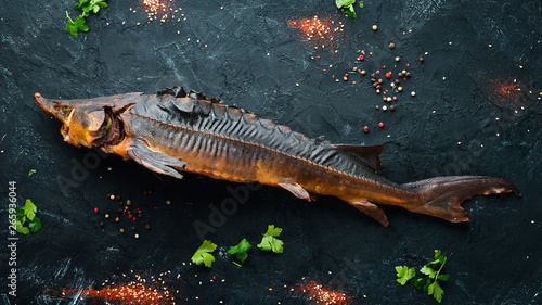 Baked Fish Sturgeon with Vegetables. Top view. Free space for your text. Rustic style.