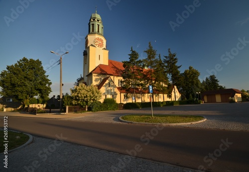 St. Katharina von Alexandria Roman Catholic Church in Dobrzen Wielki, district Opole built 1933-1934 and consecrated on October 4, 1934, in golden sunlight from July 6, 2014, Poland