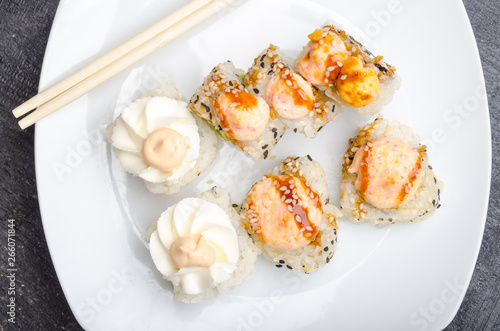 White rectangle plate with sushi rolls