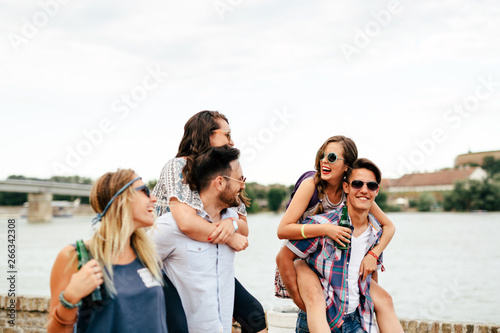 Group of young happy friends having fun time