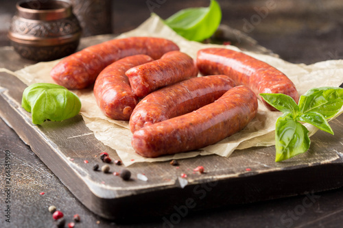 Raw grilled sausages with meat (beef, pork, lamb) and spices, hot merguez, kabanos, chorizo. Delicious food for picnic