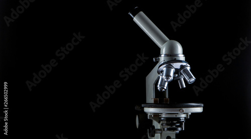 white microscope on dark background. Close up