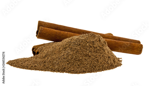 Cinnamon pile and sticks isolated on white background.