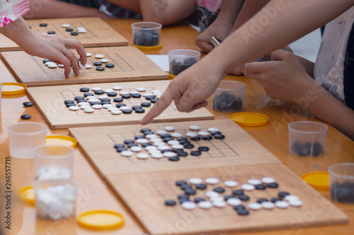 People participate in the go game. Alphago