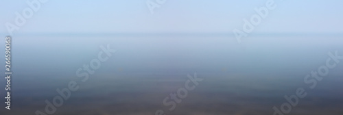 Sea coast and sky horizon blurred background 