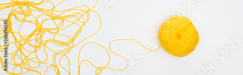 panoramic shot of knitting ball and yellow yarn Isolated On White