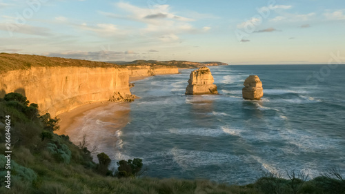 sun setting at the twelve apostles on the great ocean road