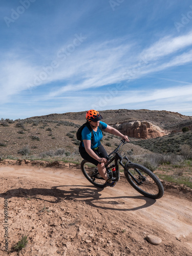 Woman mountain biking on single track in Fruita, Colorado