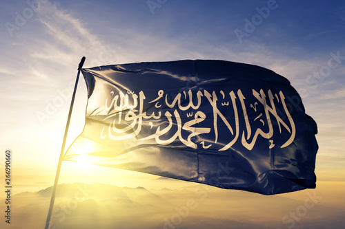 Prophet Muhammad flag waving on the top sunrise mist fog