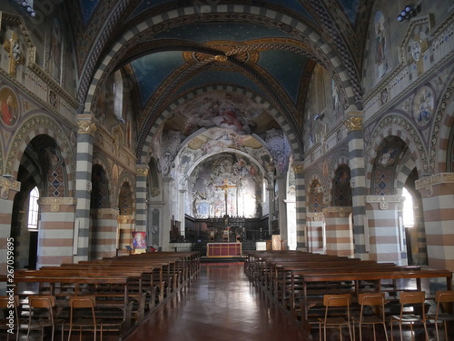 Saint Mary Cathedral in Bobbio. The interior has modern decoration in the three naves, in the presbytery and in the dome. Saint John chapel has a splendid fresco representing the Annunciation.