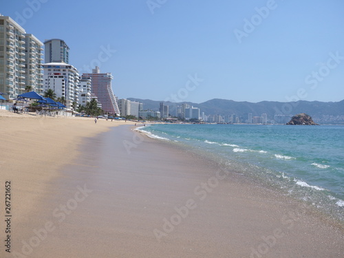 Colorful skyscrapers in ACAPULCO city in Mexico with luxury hotels buildings at bay of Pacific Ocean