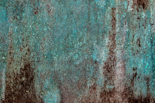 Ancient wall texture with patina or copper oxide stains. Grunge rusty background. Antique surface structure