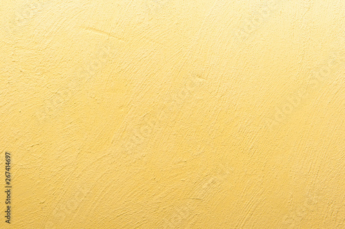 abstrakter, strukturierter Hintergrund: gelber Putz