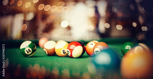 Colorful billiard balls on a billiard table.