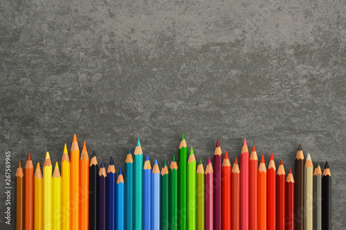 Group of colored pencils on desk with copy space