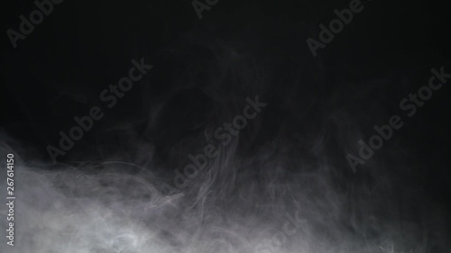 White exploding powder over black background