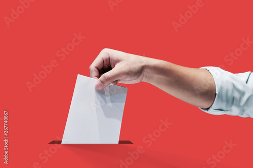 Hand holding ballot paper for election vote concept, clipping path Isolated.