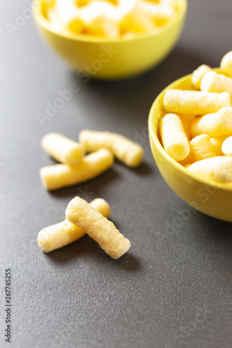 Crunchy corn puffs, pufuleti in bowl.