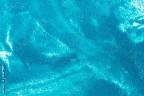close-up of gouache texture on canvas paper blue background