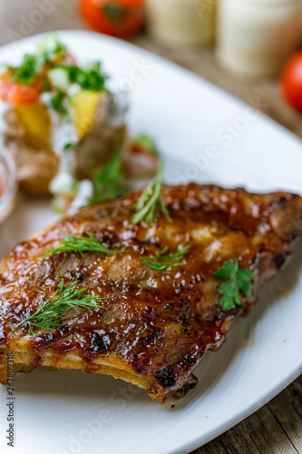 Barbecue pork ribs on wooden background