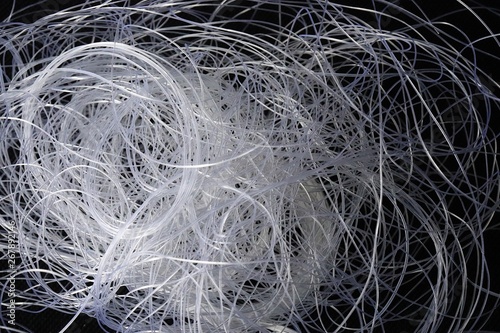 Close up of nylon thread on black background