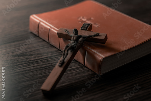 Old Holy Bible and Crucifix. Concept for religious events