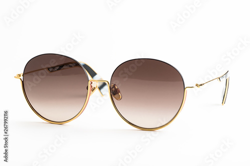 Luxury sunglasses isolated on white background. With clipping path for artwork or design. Light brown.