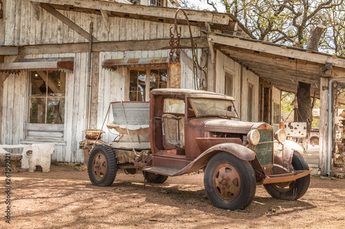 Old rusty truck and an old abandoned barn