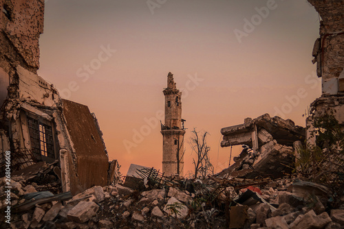 Destroyed buildings next to a mosque in the city of Aleppo in Syria