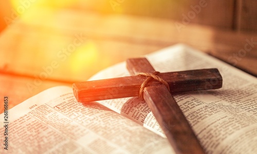 Holy Bible book and cross, close-up view
