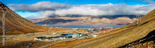 Hiking along the mountains - View over Longyearbyen and adventdalen fjord from above - the most Northern settlement in the world. Svalbard, Norway