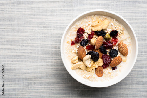 Healthy breakfast fresh granola muesli with milk and nuts