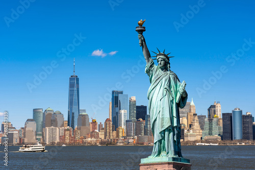 The Statue of Liberty over the Scene of New york cityscape river side which location is lower manhattan,Architecture and building with tourist concept