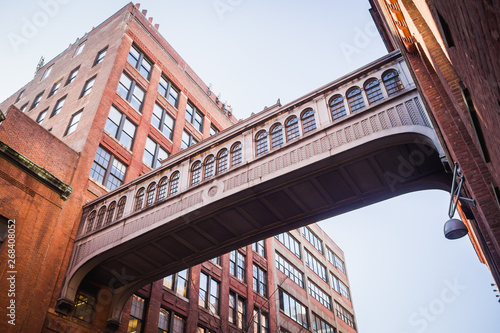 Gateway bridge between two red brick buildings in Chelsea - New York City, NY