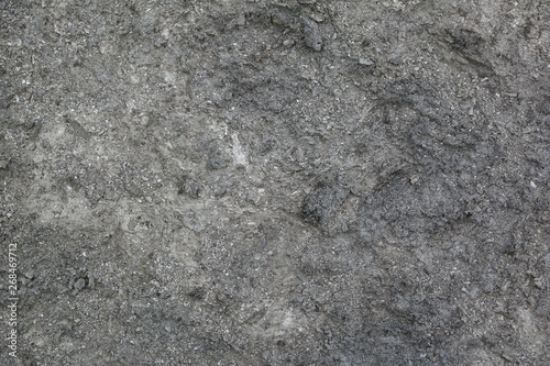 Grey sand background. Texture of ground.