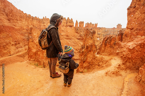 Mother with son are hiking in Bryce canyon National Park, Utah, USA