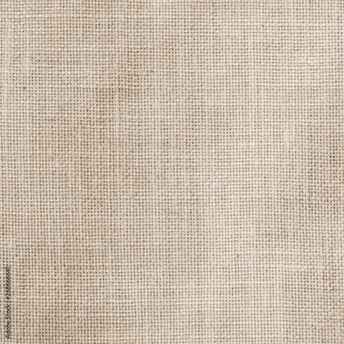 Hessian sackcloth woven texture pattern background in light sepia tan beige cream brown color